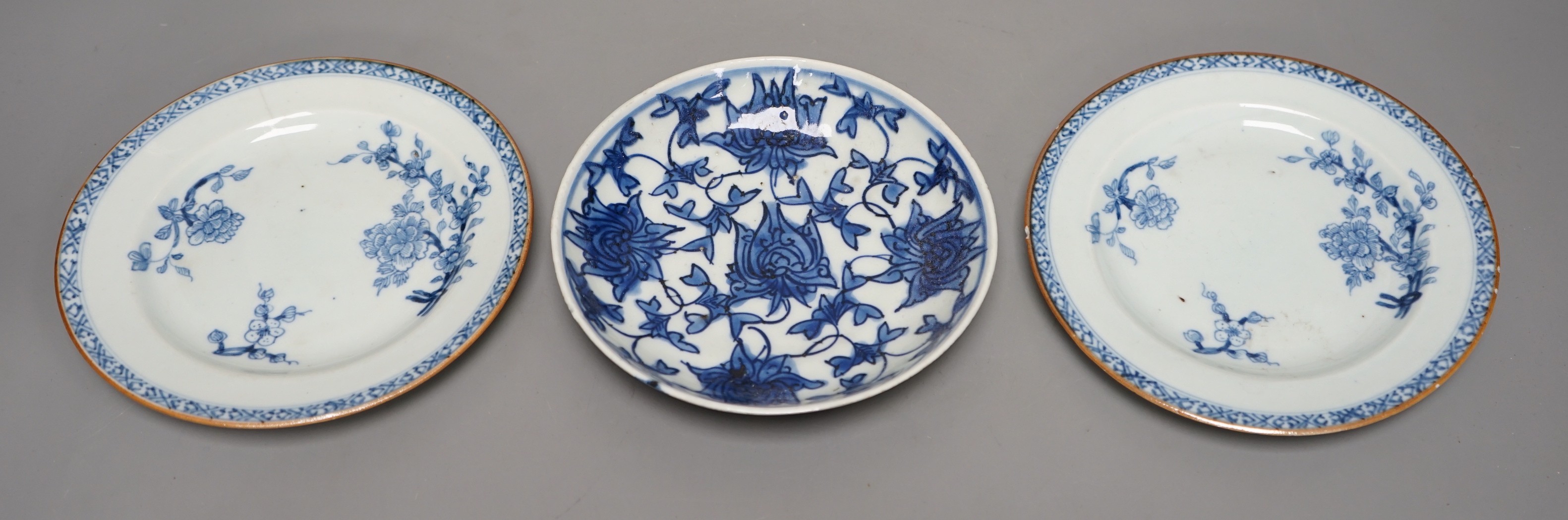 A pair of 18th-century Chinese blue and white plates and another blue and white saucer dish, largest 16cm